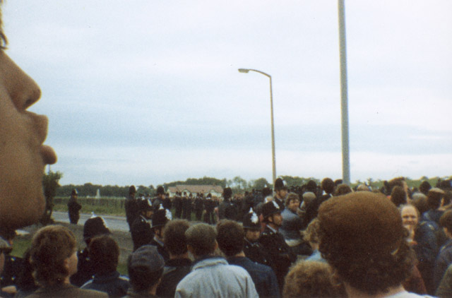 A Picketing miner at Harworth, arrested for ‘nothing’ he’s wearing a blue jacket, a picket on the left is heckling the police.